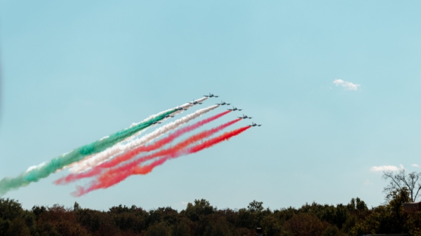 Fighter Jets flying over F1 track creating an Italian flag in the sky