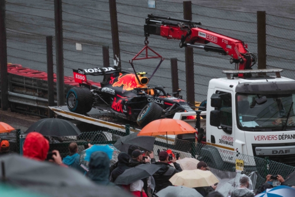 Broken F1 racing car of Sergio Perez on a transporter