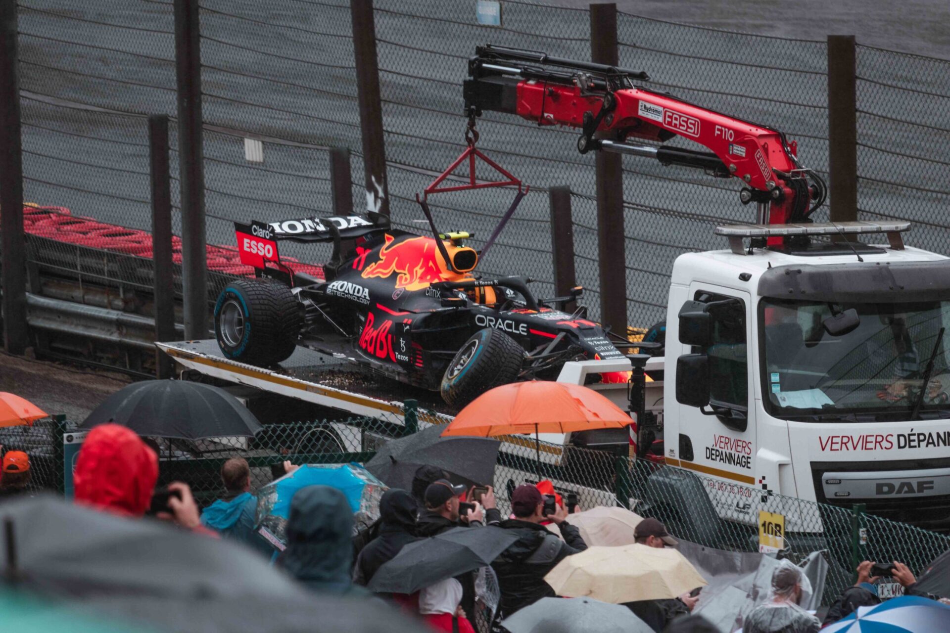 Broken F1 racing car of Sergio Perez on a transporter