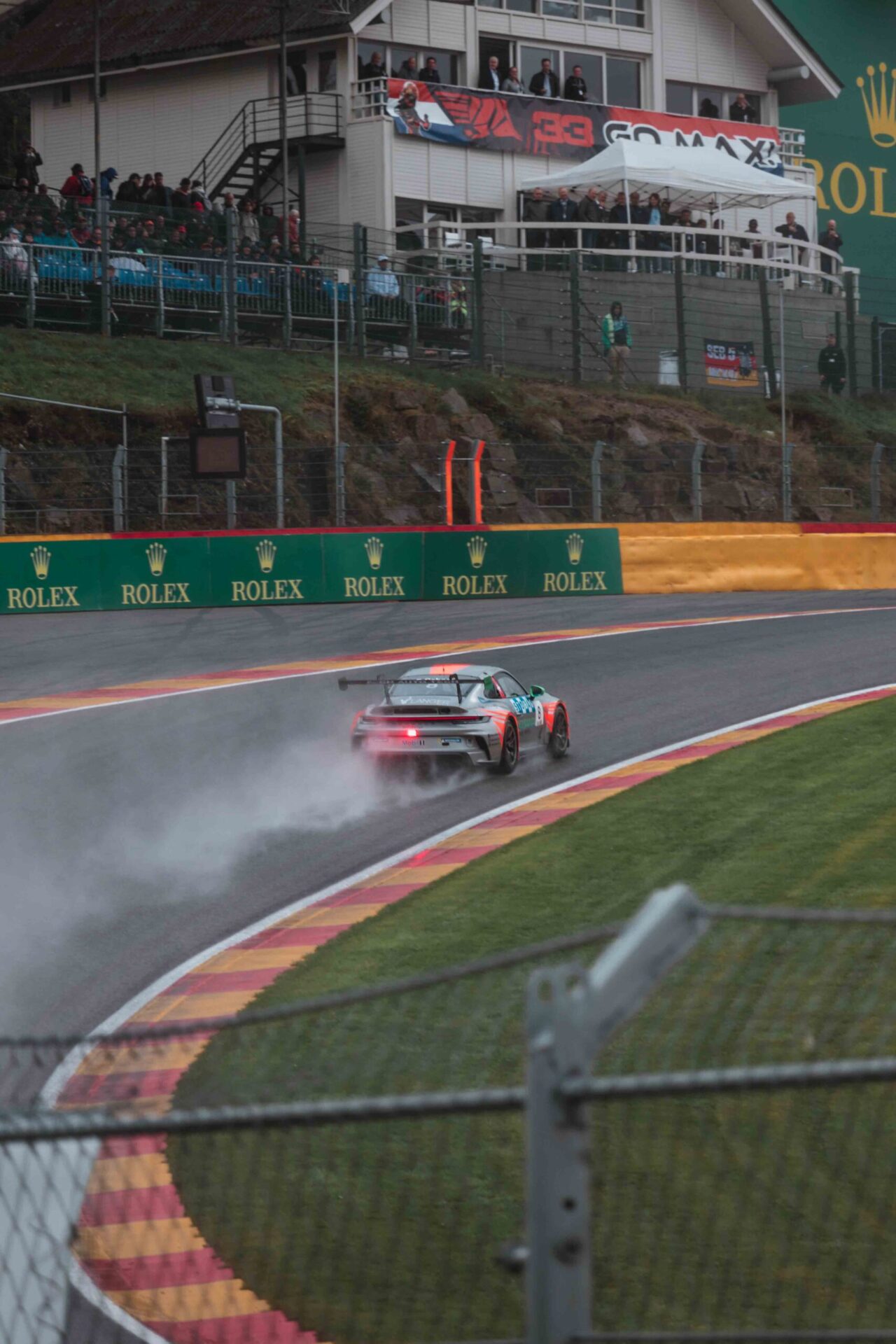 Porsche car on Eau Rouge
