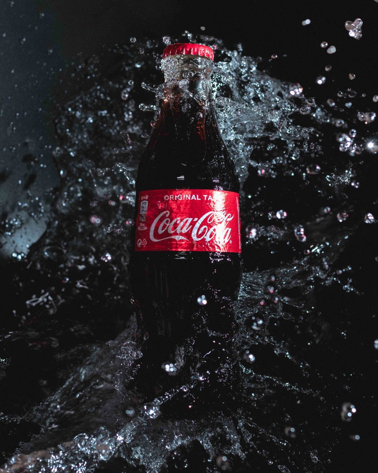coca- cola glass bottle in a professional studio photoshoot