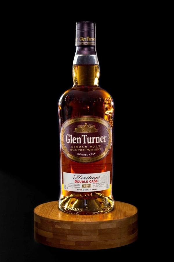 Glass bottle in a professional studio photoshoot