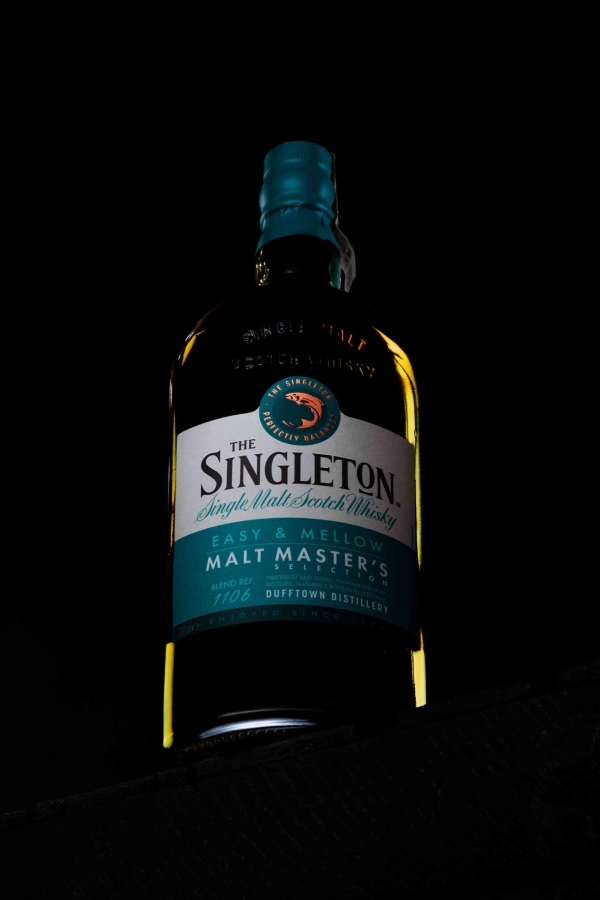 Glass bottle in a professional studio photoshoot